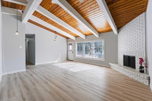 10827 Brae Road Sw, Calgary, AB - Indoor Photo Showing Other Room With Fireplace