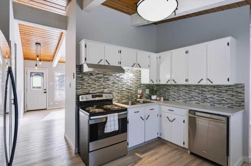 10827 Brae Road Sw, Calgary, AB - Indoor Photo Showing Kitchen With Double Sink With Upgraded Kitchen