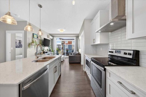 310-10 Walgrove Se, Calgary, AB - Indoor Photo Showing Kitchen With Double Sink With Upgraded Kitchen