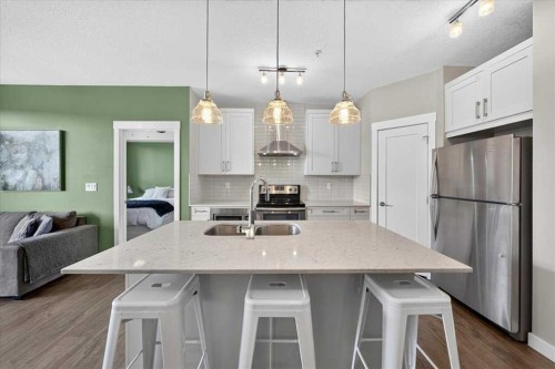 310-10 Walgrove Se, Calgary, AB - Indoor Photo Showing Kitchen With Double Sink With Upgraded Kitchen