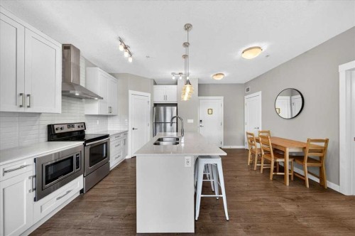 310-10 Walgrove Se, Calgary, AB - Indoor Photo Showing Kitchen With Double Sink With Upgraded Kitchen