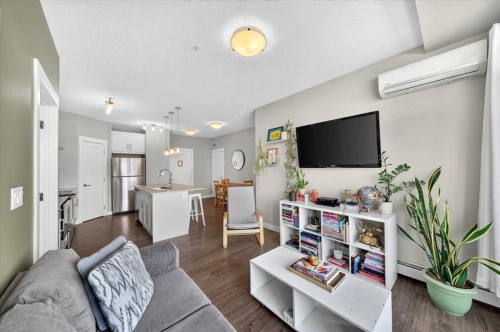 310-10 Walgrove Se, Calgary, AB - Indoor Photo Showing Living Room