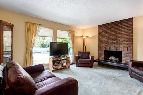 2512 106 Avenue Sw, Calgary, AB - Indoor Photo Showing Living Room With Fireplace