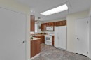 27 Bedridge Way Ne, Calgary, AB  - Indoor Photo Showing Kitchen With Double Sink 