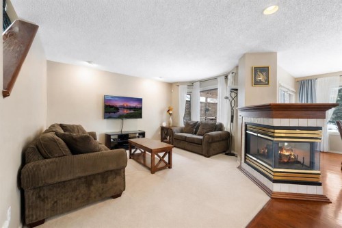 69 Hampstead Gardens Nw, Calgary, AB - Indoor Photo Showing Living Room With Fireplace