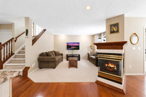 69 Hampstead Gardens Nw, Calgary, AB - Indoor Photo Showing Living Room With Fireplace