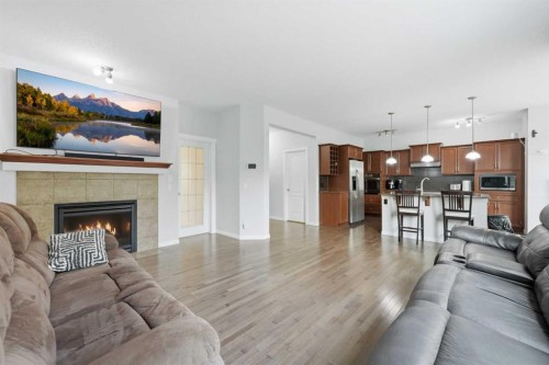 38 Silverado Skies Crescent Sw, Calgary, AB - Indoor Photo Showing Living Room With Fireplace
