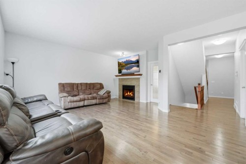 38 Silverado Skies Crescent Sw, Calgary, AB - Indoor Photo Showing Living Room With Fireplace