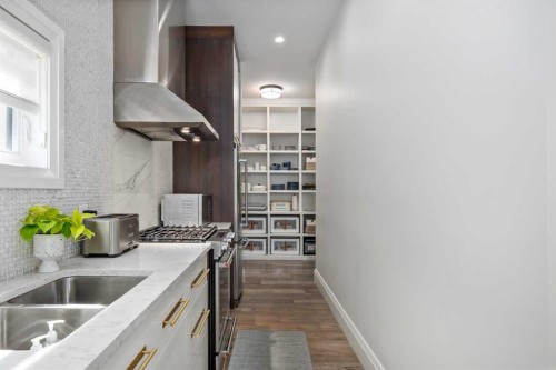 1414 Scotland Street Sw, Calgary, AB - Indoor Photo Showing Kitchen With Double Sink