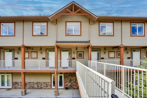 11-148 Rockyledge View Nw, Calgary, AB - Outdoor With Balcony With Deck Patio Veranda With Facade