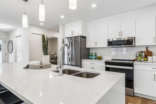 14517 Parkland Boulevard Se, Calgary, AB - Indoor Photo Showing Kitchen With Stainless Steel Kitchen With Double Sink With Upgraded Kitchen
