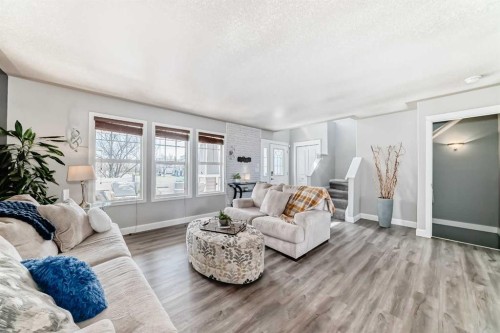 22 Moe Avenue Nw, Langdon, AB - Indoor Photo Showing Living Room