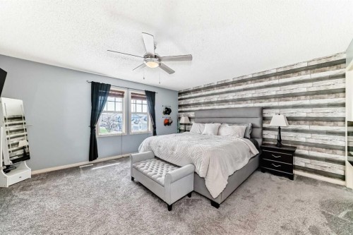 22 Moe Avenue Nw, Langdon, AB - Indoor Photo Showing Bedroom