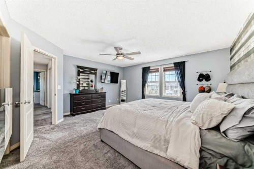 22 Moe Avenue Nw, Langdon, AB - Indoor Photo Showing Bedroom