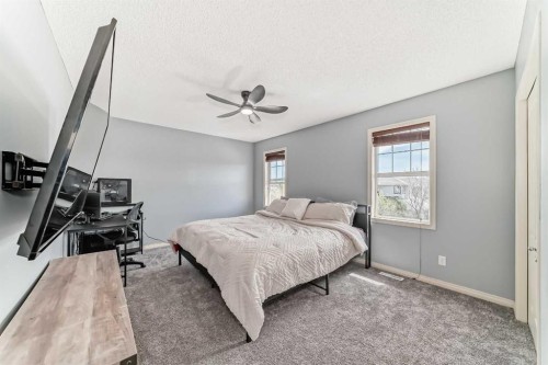 22 Moe Avenue Nw, Langdon, AB - Indoor Photo Showing Bedroom