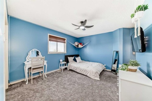 22 Moe Avenue Nw, Langdon, AB - Indoor Photo Showing Bedroom