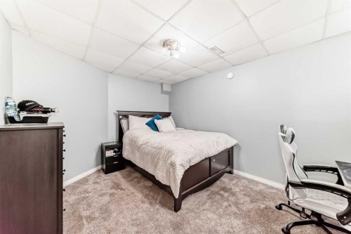 22 Moe Avenue Nw, Langdon, AB - Indoor Photo Showing Bedroom