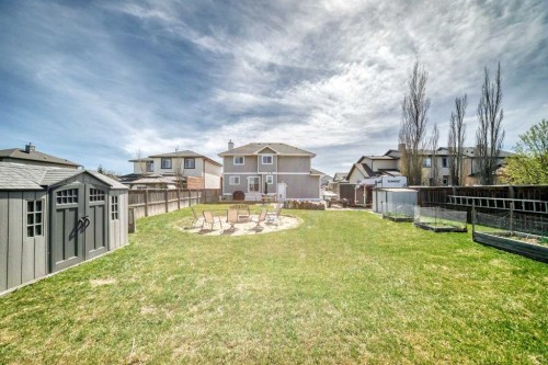 22 Moe Avenue Nw, Langdon, AB - Outdoor With Backyard