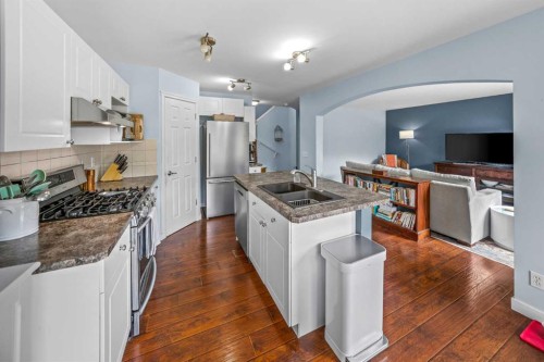 43 Cougar Ridge Bay Sw, Calgary, AB - Indoor Photo Showing Kitchen With Stainless Steel Kitchen With Double Sink With Upgraded Kitchen