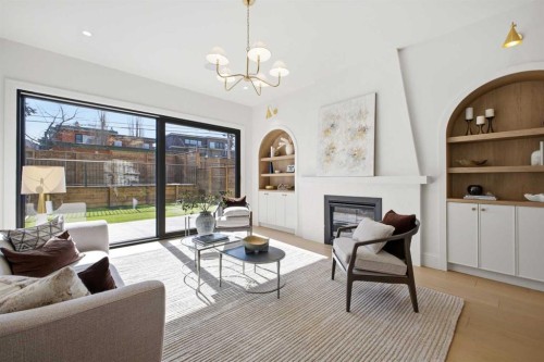 2023 27 Avenue Sw, Calgary, AB - Indoor Photo Showing Living Room With Fireplace