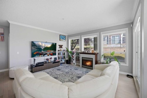 3137-1010 Arbour Lake Road Nw, Calgary, AB - Indoor Photo Showing Living Room With Fireplace