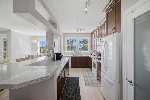 3137-1010 Arbour Lake Road Nw, Calgary, AB - Indoor Photo Showing Kitchen With Upgraded Kitchen