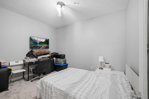 3137-1010 Arbour Lake Road Nw, Calgary, AB - Indoor Photo Showing Bedroom