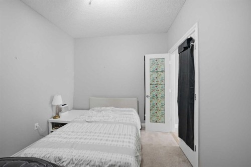 3137-1010 Arbour Lake Road Nw, Calgary, AB - Indoor Photo Showing Bedroom