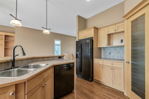 315 Willow Ridge Way, Diamond Valley, AB - Indoor Photo Showing Kitchen With Double Sink