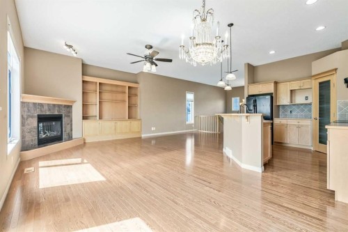 315 Willow Ridge Way, Diamond Valley, AB - Indoor Photo Showing Other Room With Fireplace