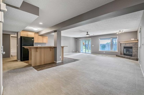 315 Willow Ridge Way, Diamond Valley, AB - Indoor With Fireplace