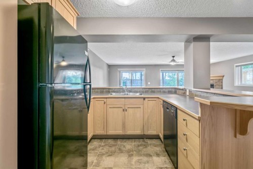 315 Willow Ridge Way, Diamond Valley, AB - Indoor Photo Showing Kitchen With Double Sink
