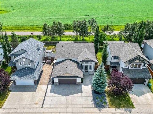 315 Willow Ridge Way, Diamond Valley, AB - Outdoor With Facade