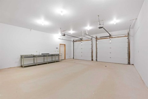 5 Eagle Drive, Waiparous, AB - Indoor Photo Showing Garage