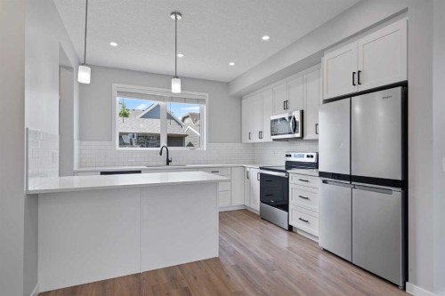 1006 Mahogany Boulevard Se, Calgary, AB - Indoor Photo Showing Kitchen With Upgraded Kitchen