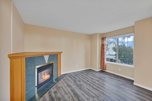 54 Martinridge Road Ne, Calgary, AB - Indoor With Fireplace