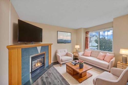 54 Martinridge Road Ne, Calgary, AB - Indoor Photo Showing Living Room With Fireplace