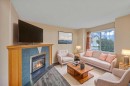 54 Martinridge Road Ne, Calgary, AB  - Indoor Photo Showing Living Room With Fireplace 