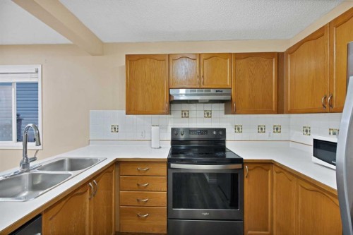 54 Martinridge Road Ne, Calgary, AB - Indoor Photo Showing Kitchen With Double Sink