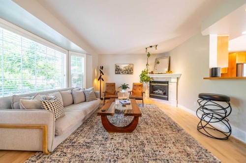 164 Somme Manor Sw, Calgary, AB - Indoor Photo Showing Living Room With Fireplace