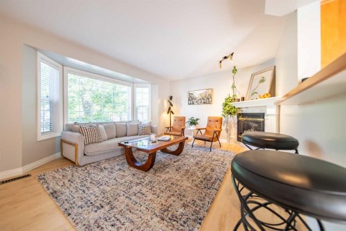 164 Somme Manor Sw, Calgary, AB - Indoor Photo Showing Living Room With Fireplace