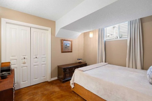 19 Rockmont Court Nw, Calgary, AB - Indoor Photo Showing Bedroom