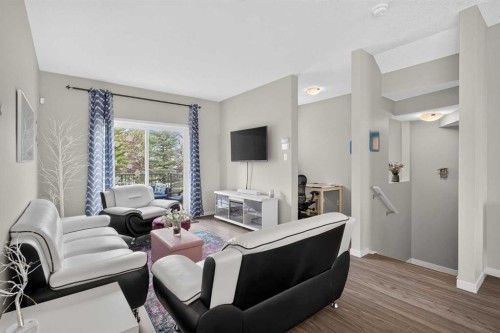 202 Copperpond Row Se, Calgary, AB - Indoor Photo Showing Living Room