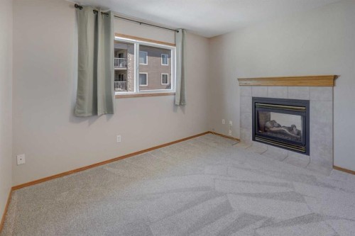 6711 Pinecliff Grove Ne, Calgary, AB - Indoor Photo Showing Living Room With Fireplace
