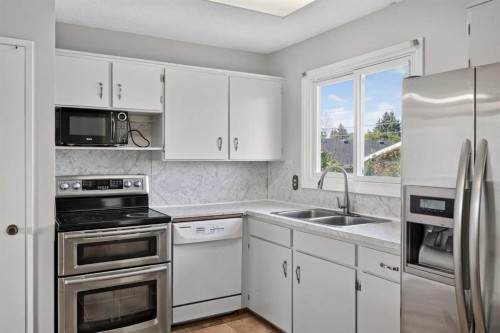7935 Huntwick Hill Ne, Calgary, AB - Indoor Photo Showing Kitchen With Double Sink