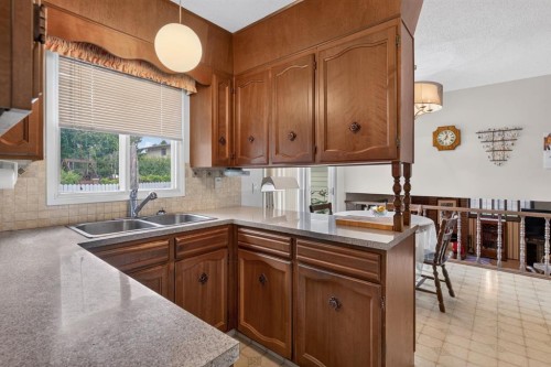 224 Silver Crest Drive Nw, Calgary, AB - Indoor Photo Showing Kitchen With Double Sink
