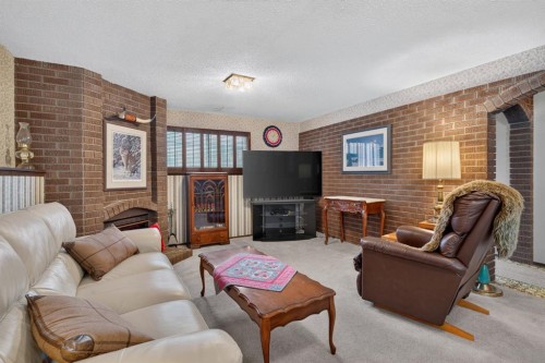 224 Silver Crest Drive Nw, Calgary, AB - Indoor Photo Showing Living Room With Fireplace