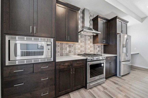 240 D'Arcy Ranch Drive, Okotoks, AB - Indoor Photo Showing Kitchen With Stainless Steel Kitchen With Upgraded Kitchen