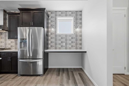240 D'Arcy Ranch Drive, Okotoks, AB - Indoor Photo Showing Kitchen With Stainless Steel Kitchen
