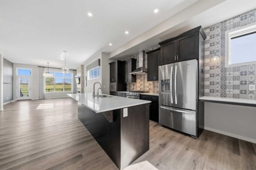 240 D'Arcy Ranch Drive, Okotoks, AB - Indoor Photo Showing Kitchen With Stainless Steel Kitchen With Upgraded Kitchen